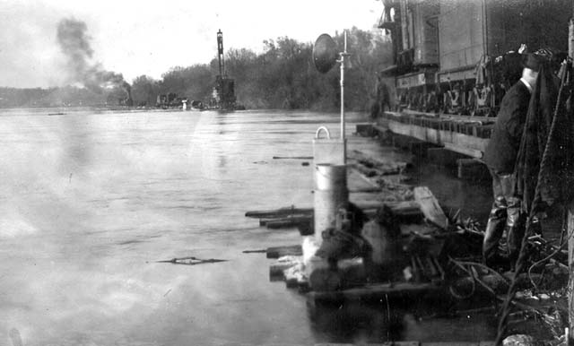 <B>New Tressel Work Wiped Out</B> by flood on April 16, 1922. Note on photograph describes this location as where the dump wash out crosses the river.