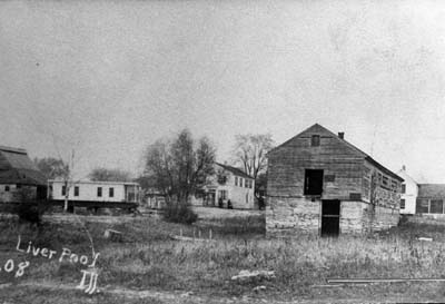 <b>Liverpool, 1908</b>.  Warren's boathouse on the right, Teddy Ellsworth house is in the center and Bill Harris' converted cabin boat is on the left.