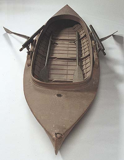 <b>Dan Kidney Duck Boat</b><br>Manufactured by the Kidney & Son Boat Factory, DePere, Wisconsin<br>Cedar wood, canvas<br>beam 3 inches, length 14 feet, weight 100 pounds<br>Double action oars by F. A. Allan, Monmouth, Illinois.  Patent December 1884 and 1888.<br>Illinois State Museum Collection, (1990.66.1a-e)<br>Gift of the family of William W. Watson, Barry, Illinois.