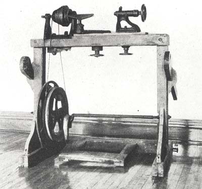 <b>Button Cutting Machine or Set-Up</b>, 1919.<br> This early version has a foot treadle and lacks the water nozzles that later machines had built in to cool the blade and keep down the dust.