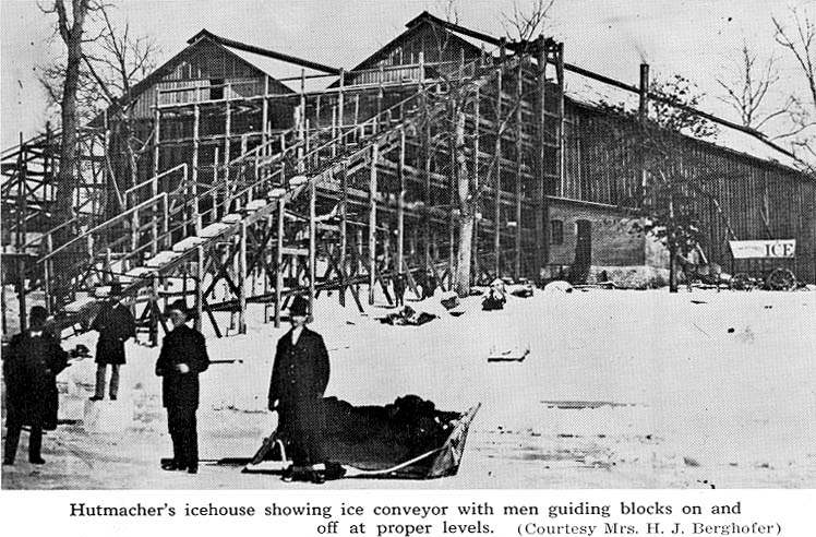 <b>Hutmacher's Ice House, Quincy, Illinois</B><BR>Men are guiding bocks of ice on and off the ice conveyor at Hutmacher's Ice House in Quincy. The blocks were arranged in layers packed with sawdust.