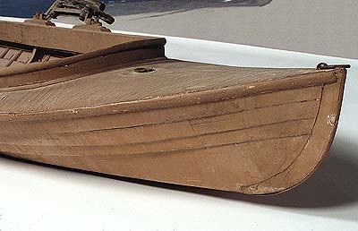<b>Wood and canvas duck boat</b>, 1897-1925.<br>Dan Kidney, DePere, Wisconsin.<br>11 1/2 inches high, 157 1/2 inches long, 36 inches wide.<br>Illinois State Museum Collection (1990.66.1)<br>Donated by Margaret Rutledge, Costa Mesa, California.