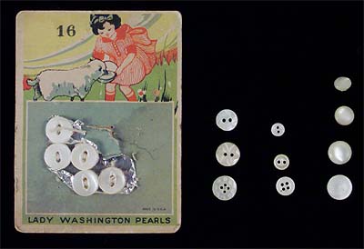 <b>Pearl Buttons</b> made from mussel shells. <br>The card indicates the small size 16 line buttons are suitable for children's clothing. The tiny buttons were used on baby or doll clothes. The styles shown are two-hole with fisheye (on card), two-hole, four-hole, and self-shank.