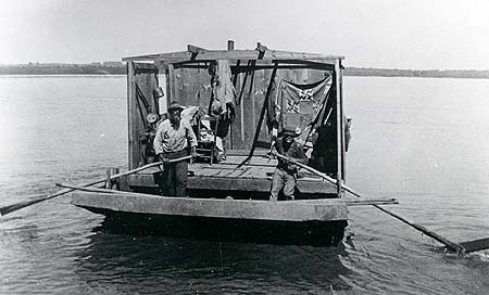 <b>Two Men on Keel Boat</b>