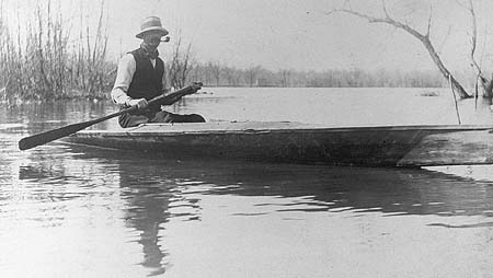 <b>Man in sneak boat</b>, circa early 1900s.  Caption identifies man as Ab Fagin.