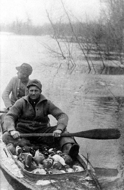 <b>Boatload of Ducks</b>, circa 1903-1920.  Caption reads 