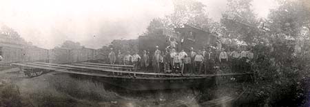 <b>Old Bridge</b> at the end of Adam's Street in Havana, Illinois.  The group is standing in front of old railroad cars.