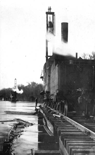 <B>Surveying Flood Damage</B> to new tressel work on April 16, 1922, near Beardstown