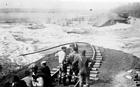 <B>Swept Away</B> Railroad workers survey the damage caused by raging flood waters of the Illinois near Beardstown. (circa 1913)