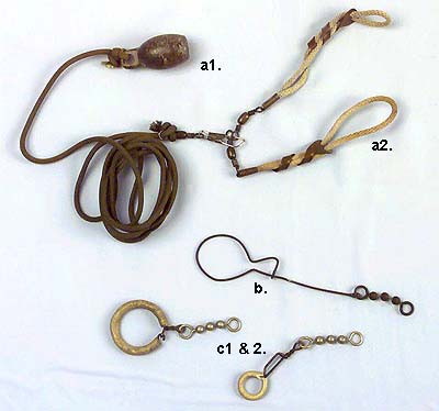 <b>Restraints for Live Decoys</b><br>Illinois State Museum Collection.<br>a1.  Weight, 2"h, 3/4"diameter 91996.118.3)<br>a2.  Decoy harness,circa 1900-1920, length 6 1/2" each loop (1996.118.1, 1996.118.2)<br>  Lawrence Keller<br>   Donated by Louis Keller, Godfrey, Illinois<br>b.  Wire and lead weights, Length 6 5/8" x width 1 5/8"<br>  Gloyd Hoesman, 1880-1930<br>  Donated by Louis H. Keller, Godfrey, Illinois.<br>c1 & 2.  Two small leads.