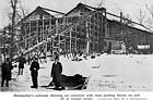 <b>Hutmacher's Ice House, Quincy, Illinois</B><BR>Men are guiding bocks of ice on and off the ice conveyor at Hutmacher's Ice House in Quincy. The blocks were arranged in layers packed with sawdust.