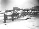 <B>Ice Conveyor</B><BR>This 1900 photograph shows the blocks of ice being pushed up the ice conveyor to a higher level of the riverbank. The men will load it onto the wagon, which will take it to the ice house for storage.