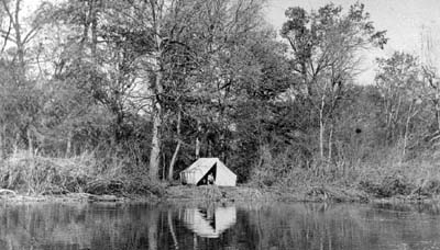 <b>Camp, November, 1909</b>.  Hunters often set up camps for the entire hunting season, since traveling wasn't as convenient in the early 1900s as it is today.