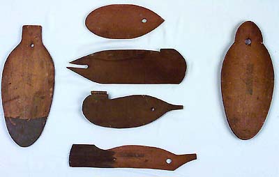 <b>Patterns for making decoys</b><br>Left:  Canvas back base made by Tony Leiber. (12 inches long by 5 inches wide).  Center:  Blackjack base by Fred Mott Sr. and Jr.  (1968.12, 798893.1); Mallard base (798893); Blackjack profile by Fred Mott Sr. and Jr. (1968.12, 798893.1); Mallard profile by Fred Mott Sr. and Jr. (1968.12, 798893) .  Right:  Mallard base by Tony Leiber  (1968.12, 798893.2).<br>Illinois State Museum Collection.