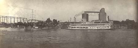 <b>The Columbia</b> near the Adams Street bridge and grain elevators viewed from the Fulton County side of the Illinois River at Havana.