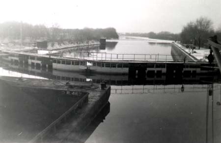 <b>Locking Through</b>.  The W. W. Maring passes through a lock and dam.