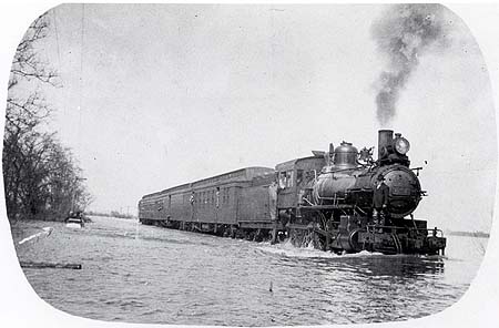 <b>Train in Flood</b> between Naples and Valley City, circa 1903-1920.