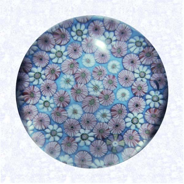 <B>Pink and White Pattern Millefiori<BR>France<BR>Clichy, circa 1845-55</B><BR>Diameter:7.6 cm (3 inches)<BR>(702383)<BR><BR>Pattern millefiori with pink and white millefiori canes on an opaque light blue ground, including one lavender and yellow signature cane inscribed with a blue &quotC."