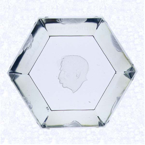 <B>Engraved Albert Schweitzer Weight<BR>Sweden<BR>Kosta Glass Works, 1962</B><BR>Diameter: 10.5 cm (4 1/8 inches) Height: 4.5 cm (1 3/4 inches)<BR>(745669)<BR><BR>Hexagonal clear glass weight with tapered base; engraved portrait of Albert Schweitzer by Vicke Lindstrand on underside of base; 