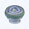 Millefiori on Lattice Pedestal BaseFranceSaint Louis (signed), dated 1848Diameter: 8 cm (3 1/8 inches)(702295)Close concentric millefiori with nine concentric rings of multicolored millefiori canes, including one black signed and dated cane inscribed 