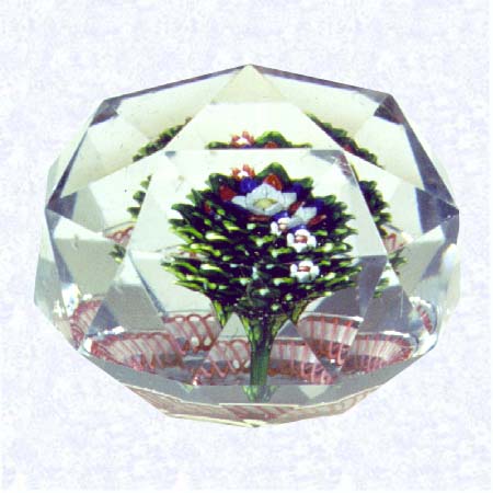 <b>Baccarat Triangular-faceted Upright Bouquet<br>France<br>Baccarat, circa 1845-55</b><br>Diameter: 7.6 cm (3 inches)<br>(702320)<br><br>Upright bouquet with a pink torsade; star-cut base; entire surface of weight cut with triangular facets