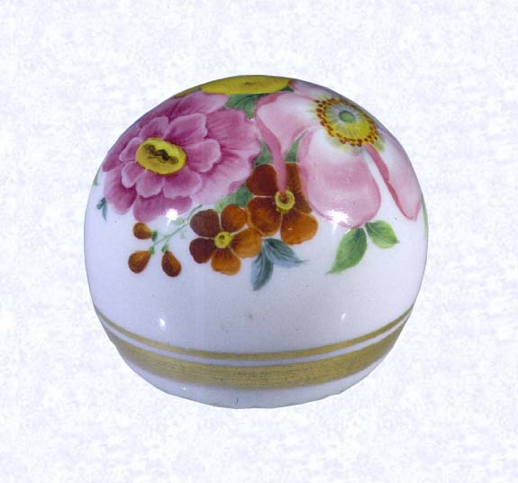 <B>Hand-painted Paperweight (view two)<BR>Bohemia<BR>factory unknown, circa 1850-1900</B><BR>Diameter: 6.5 cm (2 1/2 inches)<BR>(702341)<BR><BR>Clear glass weight overlaid with opaque white glass; hand-painted flowers in pink, yellow, blue, and rust with green leaves; two gilded bands encircling base; deep star-cut extending to perimeter of base