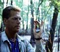 - Ornithologist with warbler -